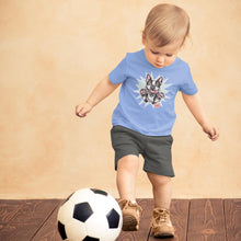 Load image into Gallery viewer, toddler kicking a soccer ball wearing a blue OMG You're Home t-shirt with the Boston Terrier dog design on the front