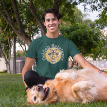 Load image into Gallery viewer, a man in a park wearing a green golden retriever t-shirt with his golden retriever dog