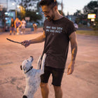 a man with his dog playing fetch with a stick