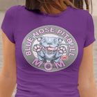 a woman wearing a purple tshirt