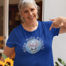 Load image into Gallery viewer, Smiling woman pointing to her royal blue t-shirt featuring the Blue Nose Pitbull design by OMG You&#39;re HOME!