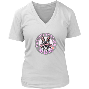 A women's white v-neck shirt from OMG You're Home! with the Boston Terrier dog Mom design on the front in pink letters