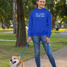 woman in a blue hoodie with her dog
