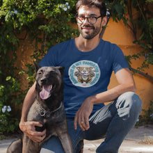 Load image into Gallery viewer, a man kneeling with his dog wearing a blue Triblend t-shirt by Next Level featuring the original Red Nose Pitbull artwork by OMG You&#39;re Home! Part of the &quot;Rescue is my favorite breed&quot; collection.