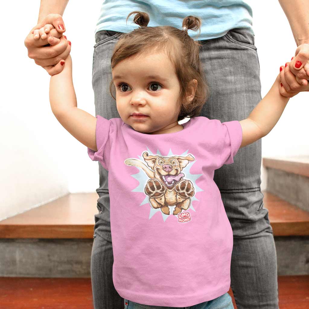 a toddler standing with her mom wearing a pink OMG You're Home t-shirt featuring the original Yellow Labrador Retriever dog design on the front in full color